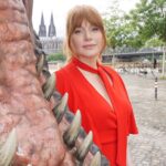 Bryce Dallas Howard Instagram - Dinosaurs, but make it fashion 🦖 Thank you Germany for being an incredible last stop on this leg of our international travels!! Next stop, home sweet home: Los Angeles! #JurassicWorldDominion ⁣ ⁣ Makeup: Kara Bua (@karayoshimotobua) ⁣⁣⁣⁣⁣ London/ Germany Hair: Christian Wood (@cwoodhair)⁣⁣⁣ Manicure: Ariane Brimah⁣ And special thanks to @alex.schack✨⁣ ⁣ [ID 1 & 2: BDH signs autographs, wearing a plum floor-length Pamella Roland gown with fancy silver beading along the neckline and sleeves.]⁣ ⁣ [ID 3: In front of a dinosaur installation in Trafalgar Square, BDH wears a bright tennis-ball yellow Alex Perry dress with an angular silhouette and neck cutout]⁣ ⁣ [ID 4 & 5: Rexy and BDH roar in Germany; BDH wears a midi red Valentino dress with matching red pumps that made her very tall]⁣ ⁣ [ID 6: Izzy Sermon, BDH, and Laura Dern speak at the London crew screening of Jurassic World Dominion. BDH wears a caramel-hued Self Portrait mesh midi dress and black blazer. She’s emotional saying thank you to all the people]