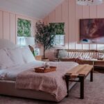 Bryce Dallas Howard Instagram – A look inside @brycedhoward’s bedroom! We had so much fun creating this space. Before, it was a drywall box, so to add texture we brought in pink wainscoting and shiplap, matching the cadence already found in this historic home.

Bryce uses this room almost like a salon – a creative space to work and collaborate – so I knew we needed a big cozy chair. Enter the @joybird chair and a half! (It really lives up to its name!) And I love the rounded headboard of the Dania bed against the lines of the room. I’m so excited to include @joybird in another project! 💛💛💛#ad #joybird