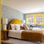 Bryce Dallas Howard Instagram - Today, January 31st, would have been my Grandma Jean’s 97th birthday which makes it all the more meaningful to share this @archdigest tour with you. My Grandma Jean inspired so much of how we decorated this house 💛⁣ ⁣ This is my second design collaboration with the exceptional @clairethomas. Claire has such a special gift for bringing out the story in anything and our home is just another example of that — every room is a different story of our family and what we most treasure. Thank you, thank you, thank you Claire!⁣ ⁣ Watch the AD tour of this Wes Anderson meets Jane Austen style home at the link in bio 🔗⁣ ⁣ Photography: @donnadotanphoto⁣ Interior Styling: @emilypertzborn⁣ Design: @clairethomas⁣ Writing: @kristenflanagan⁣ ⁣ [ID: Sitting in her kitchen, which now bounces with light, BDH smiles and rests on the countertop by the oven. She wears navy blue jeans, white sneakers, and a grey sweater with blue stripes.]⁣ ⁣ [ID: Splashes of Grandma Jean and Seth’s Nana around the home, like the open display of Depression glassware in the dining room and the bright blue wallpaper with yellow lemons in the guest room.]