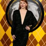 Bryce Dallas Howard Instagram - London, you make my heart so full! ❤️ #ArgylleMoviePremiere⁣ ⁣⁣ 📸: Getty Images for Universal Pictures Hair: @cwoodhair⁣⁣ Makeup: @karayoshimotobua⁣⁣ Styled by Publicist Extraordinaire: @alex.schack⁣⁣ ⁣⁣ [ID: In front of blue and yellow Argylle-themed backdrops, BDH poses for photos at the UK premiere of #ArgylleMovie. She wears a long, glittering emerald green dress with a deep v-neckline and deep crimson lipstick. Her straightened hair falls behind her back to show off her earrings.] Odeon Luxe Leicester Square