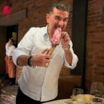 Buddy Valastro Instagram - Who needs a fork when you're diving into a legendary bistecca 🥩 #FeastMode #BisteccaBliss #handsonfeast