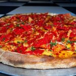 Buddy Valastro Instagram - Excessive Heat Warning!! We know it’s hella hot outside, but we want to make it even hotter with our Flaming Hot Pie. Lots of spice, buffalo sauce, Flamin’ Hot Doritos AND Flamin’ Hot Cheeto dust. #pizzacake #buddyvalastro #flaminhot #flaminghot #pizza #heatwave #excessiveheatwarning #bringtheheat #harrahs #vegas #vegasstrip Harrah's Las Vegas
