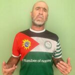 Éric Cantona Instagram - @primalscreamofficial have teamed up with @aidaceltic and @anumberofnames to make the palestinadelica football shirt. ALL proceeds from sales go towards helping train and provide sportswear for the Aida refugee camp football team. If u want to buy a shirt go to < www.aidaceltic.com> The history of the club is also on the site