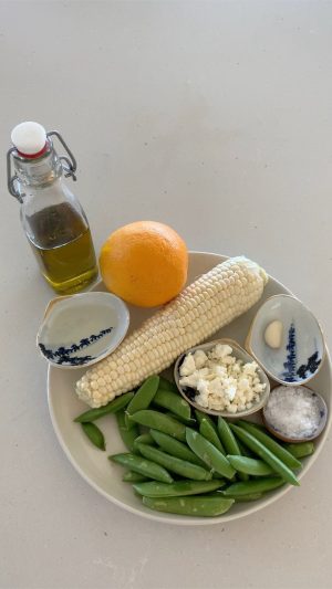 Cameron Diaz Instagram - Hey ya’ll just cookin a summer snack. It’s a quick pan roasted corn and fresh pea salad with feta cheese and a champagne orange & garlic vinaigrette.. 
Pairs well with @avaline white wine !! Hope you enjoy!
.
Ingredients :
-1 ear of corn 🌽
-handful of snap peas
-Feta Cheese (crumbled)
-1/2 orange
-1garlic clove
-champagne vinegar 
-olive oil
-@maldonsalt (not a paid advertisement) 
I just LOVE IT!!