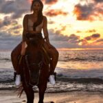 Candice Patton Instagram - Never approach a bull from the front, a horse from the rear, or a fool from any direction. Tomate 🍅 and I on a sunset stroll. #bliss 🇲🇽 Punta De Mita, Nayarit, Mexico
