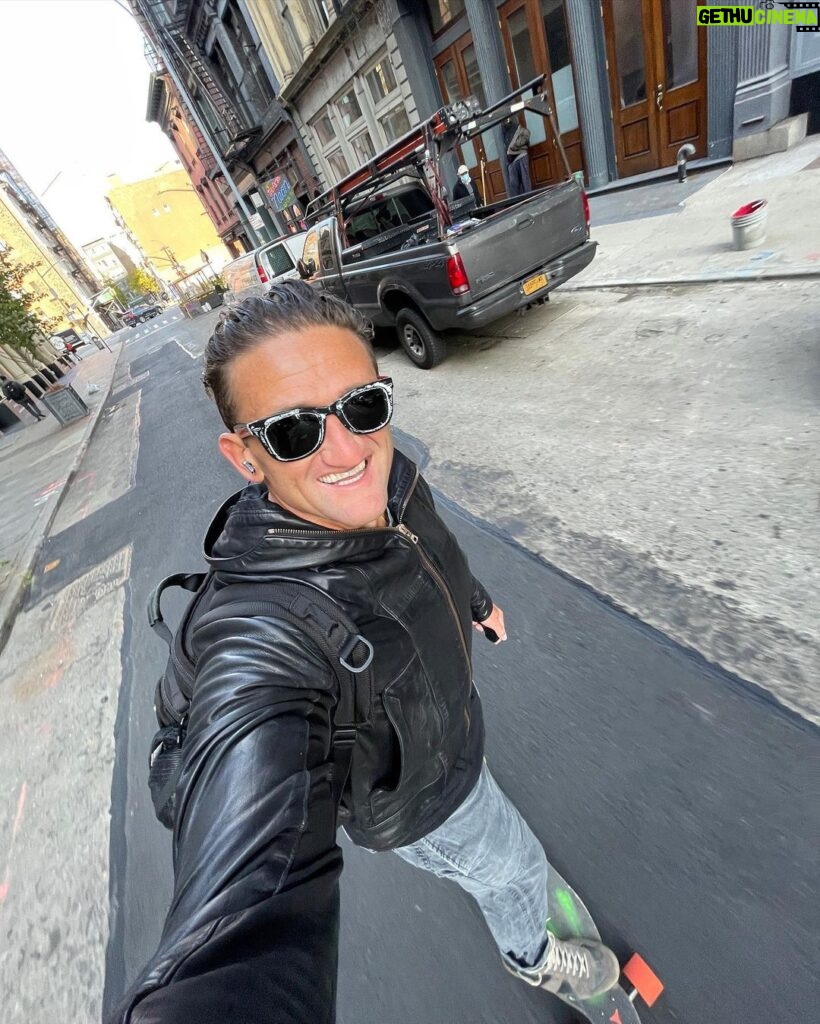 Casey Neistat Instagram - it’s 2021, im riding a boosted board through the streets of new york city and all is right in the world New York City