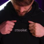 Chandler Hallow Instagram - I am proud to introduce the first drop of the Strange Hands Clothing line! My team and I have put in countless hours over the past few months to make sure the Strange Hands brand followed my ideals, Quality, Value, and Community. This is why I decided to make the SH Clothing Line an exclusive Members only brand! Accessible only through my Strange Hands NFT. NFTS offer the opportunity for us to build this brand together and make something we are proud of. We are moving rapidly by selling out all 3000 NFTS in January 2022, launching regular events in our Discord that allows our members to interact with my Team and I, creating our own custom GTA server, and funding our Community wallet with close to 13 ETH ($40,000approx.) that YOU the holders decide what to do with, $20k competition in March, and more! However! I want this brand to last a lifetime. I want everyone who invests into Strange Hands to see this as something they want to be apart of for years to come. Not to make a quick buck from reselling. I am dedicated to bringing VALUE to holding my SH NFT by incorporating your thoughts into the benefits of investing into this project. I invite everyone to come to our Discord tonight at 9:00pm EST while we host an AMA and talk about everything we have in store for our holders. Some of you may be new to the NFT space and we want to be the community that helps guide you through it and have tons of fun in the process! We will see you all tonight! AMA Live Event: Feb. 18th 9:00 PM Est Check out the discord link in bio and my story for more details 🤚❤️