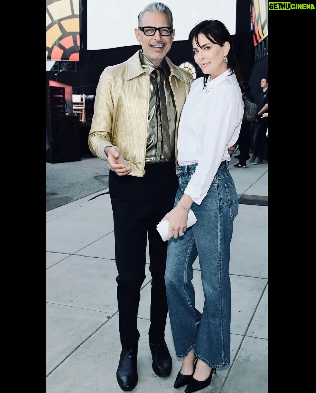 Charlize Theron Instagram - Another epic @ctaop block party in the books ✅ It was such a fun night and I’m beyond grateful to everyone who came out & showed up for the work we’re doing for young people in Africa. Special shout out to our amazing partners at Universal, team @jurassicworld, and @dior. Aaand extra special shout out to the incredible @wyclefjean for bringing the house down and letting me dance my ass off on stage with you! 📸: @gettyentertainment Universal Studios Hollywood