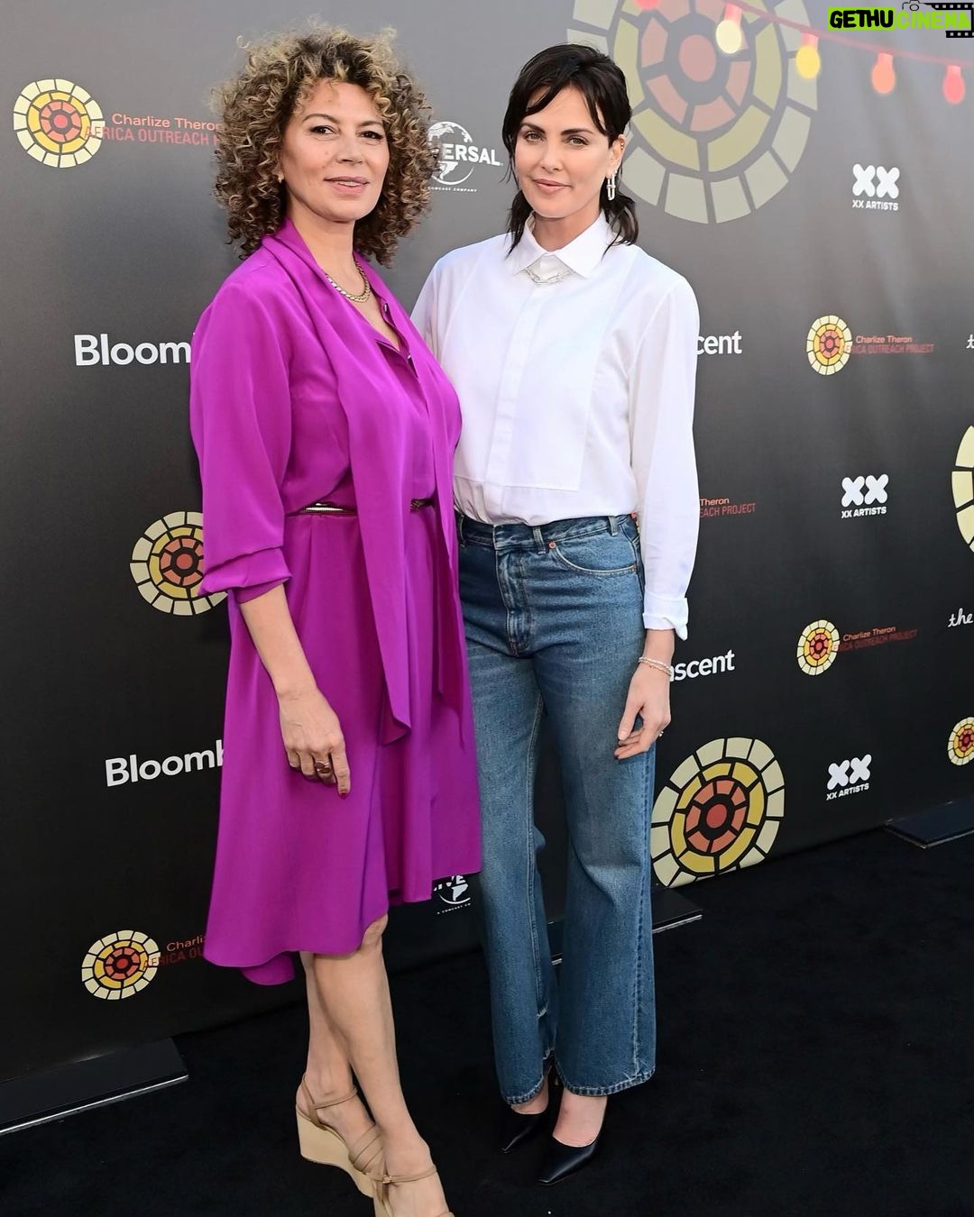 Charlize Theron Instagram - Another epic @ctaop block party in the books ✅ It was such a fun night and I’m beyond grateful to everyone who came out & showed up for the work we’re doing for young people in Africa. Special shout out to our amazing partners at Universal, team @jurassicworld, and @dior. Aaand extra special shout out to the incredible @wyclefjean for bringing the house down and letting me dance my ass off on stage with you! 📸: @gettyentertainment Universal Studios Hollywood