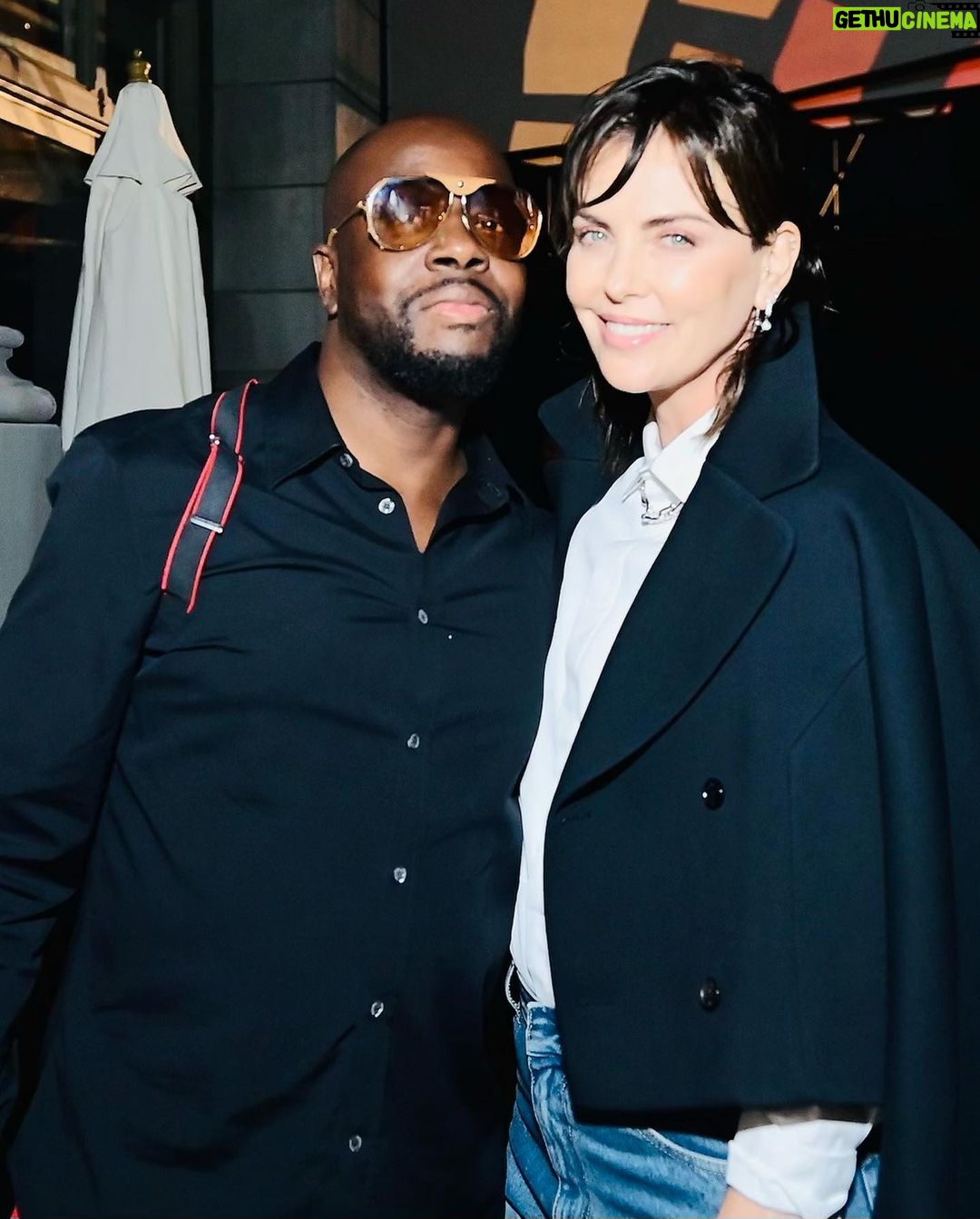 Charlize Theron Instagram - Another epic @ctaop block party in the books ✅ It was such a fun night and I’m beyond grateful to everyone who came out & showed up for the work we’re doing for young people in Africa. Special shout out to our amazing partners at Universal, team @jurassicworld, and @dior. Aaand extra special shout out to the incredible @wyclefjean for bringing the house down and letting me dance my ass off on stage with you! 📸: @gettyentertainment Universal Studios Hollywood