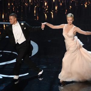 Charlize Theron Instagram - In honor of #InternationalDanceDay, throwing it back to that time I got to relive my dancing days at the Oscars💃
When @macfarlaneseth asked me to do this he made it sound like I’d just have to hop onstage and do a quick spin, and then he tells me to show up to rehearsals and it’s a whole damn choreographed number! 
So thanks for tricking me into what turned out to be an amazing experience. And shoutout to @channingtatum for being the best dance partner EVER 

📸: Kevin Winter/Getty Images; Mark Davis/WireImage