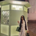 Chloe Khan Instagram - Not willing to accept it’s nearing the end of summer but ready to wear warm clothes 🧸 🤍 Prada Caffè at Harrods