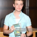 Chris Colfer Instagram - I cannot believe it’s been 10 YEARS since I gave birth to my first book baby. I mean, look at this kid! He had no idea what was in store. Thank you all so much for going on this adventure with me. I can’t wait to celebrate with the 10th Anniversary edition of #TheWishingSpell this fall and for all of you to see the surprises coming up! A huge thank you to @littlebrown for believing in the world trapped in this guy’s head. ❤️❤️❤️❤️❤️❤️❤️❤️❤️❤️❤️❤️❤️❤️❤️❤️ #TheLandOfStories #ATaleOfMagic