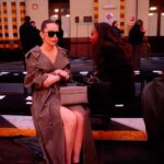 Christine Chiu Instagram - It’s all fun and games until they turn off the heated seats 🤣 last slide for #mfw #realness @tods x @aaronidelson #milanfashionweek #todsfw24 #Tods Milan Fashion Week