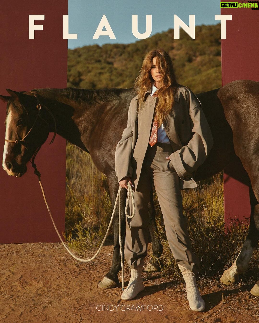 Cindy Crawford Instagram - @CindyCrawford in Bottega Veneta for the 25th Anniversary Issue, Under the Silver Moon, out now! Cindy Crawford, one of the world’s first and most well-known supermodels, is a rare icon that represents the past, the present, and the future. As seen in the recent @AppleTv docuseries ‘The Super Models’ Crawford has made a profession out of risk-taking and has successfully navigated an ever-changing world of fashion, modeling, and media. As a mother, model, and founder of @MeaningfulBeauty, Crawford creates a new understanding of how someone can take total command over their life and legacy. On what she hopes to be remembered for, Crawford says, “I hope my children remember being unconditionally loved by me.” Read the full feature on flaunt.com and get the issue at the link in bio! Cindy wears #BottegaVeneta jacket, shirt, pants, tie, and boots. Photographed by @GregSwalesArt Styled by @MuiHai Written by @FranchescaBaratta Hair: @DimitrisHair Makeup: @Harold_James Nails: @StephStoneNails Producer: @AlexeyG @agpnyc Flaunt Film: @ShootChevyTyler Set Designer: @TheNinjaAtelier Location: @StoneFoxRanch #FlauntMagazine #UnderTheSilverMoon #CindyCrawford