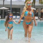 Coco Austin Instagram - Our flight was canceled so we made a detour back in the pool 💦💦💦 Thanks to our friends at @fedeswimwear for our cute matching suits👙 Fort Lauderdale, Florida