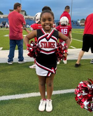 D.J. 'Shangela' Pierce Instagram - #ProudUncle post … Last night lil’ Karli cheered her last game of the season. She’s in fourth grade now and she loves to dance, flip around the house, make TikToks and cheer … just like her #UncleDJ at that age 😁. Even tho she’s a firecracker at home, she sometimes struggles with a bit of social anxiety … but her mom told me she joined the cheer squad with her lil bestie in an effort to combat it. Me, her Mom, and her entire family are SO PROUD of her!! I’ll be rooting this lil one on for her entire life ❤️ She’s got the moves and I hope to help her (as I hope y’all will support her) to build her confidence every day. If anyone has any childhood social anxiety tips, please drop 👇🏾