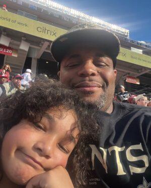 Daniel Cormier Instagram - Father’s Day is such a special day for everyone. I am blessed to be Dad to my children. They have made me better in area of life. I had a great dad and his work and the way he lived made me approach my family in the way I do today. Kids you’re my guiding light and pops we think about you everyday. Happy Father’s Day all  1. Dan Dan and I in Washington , DC.  2. With Marquita at the Saints Game.  3. Luna and I just hanging on the porch.  4. My Dad Percy Benoit (RIP dad)