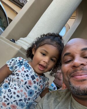 Daniel Cormier Instagram - Father’s Day is such a special day for everyone. I am blessed to be Dad to my children. They have made me better in area of life. I had a great dad and his work and the way he lived made me approach my family in the way I do today. Kids you’re my guiding light and pops we think about you everyday. Happy Father’s Day all  1. Dan Dan and I in Washington , DC.  2. With Marquita at the Saints Game.  3. Luna and I just hanging on the porch.  4. My Dad Percy Benoit (RIP dad)