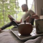 Daniel Gillies Instagram - my amazing girlfriend @msjuliamisaki recently launched the remarkable HIKARI TEA available domestically in the United States. go to hikaritea.com or hit the link in my bio. 100% organic loose leaf japanese tea and i’m not certain it doesn’t have actual magical properties. quite honestly, I consider it one of the essential elements of my day now. zero ‘speediness’ that I often find with coffee; only mental clarity and calm. the quality of the flavor is so beautiful: the subtlety of texture and the rich fullness of the leaf. go to her site and order some or I’ll hunt you down. 🇯🇵❤️🫖 meanwhile here are some pics of Julia and I wandering through Japanese gardens, me reading a book and staring pensively into the distance (not at all staged and YES you can buy that adorable teapot from the site) and Julia looking 🔥 in Paris (also drinking tea). ❤️❤️❤️