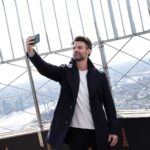 Daniel Gillies Instagram - so fun. yesterday we did a little shoot in the Empire State Building. @empirestatebldg super impressive and a such a joy when you’re promoting the best film of 2021: ‘Coming Home in the Dark’ releases this Friday on VOD and in Theatres, stateside. (Yes, I said ‘the best’… Not even fucking close. What are you gonna do about it?) 🖤 PS: Can anyone else see the little happy face in the viewfinder-binoculars chrome thing? I can’t unsee that!!!