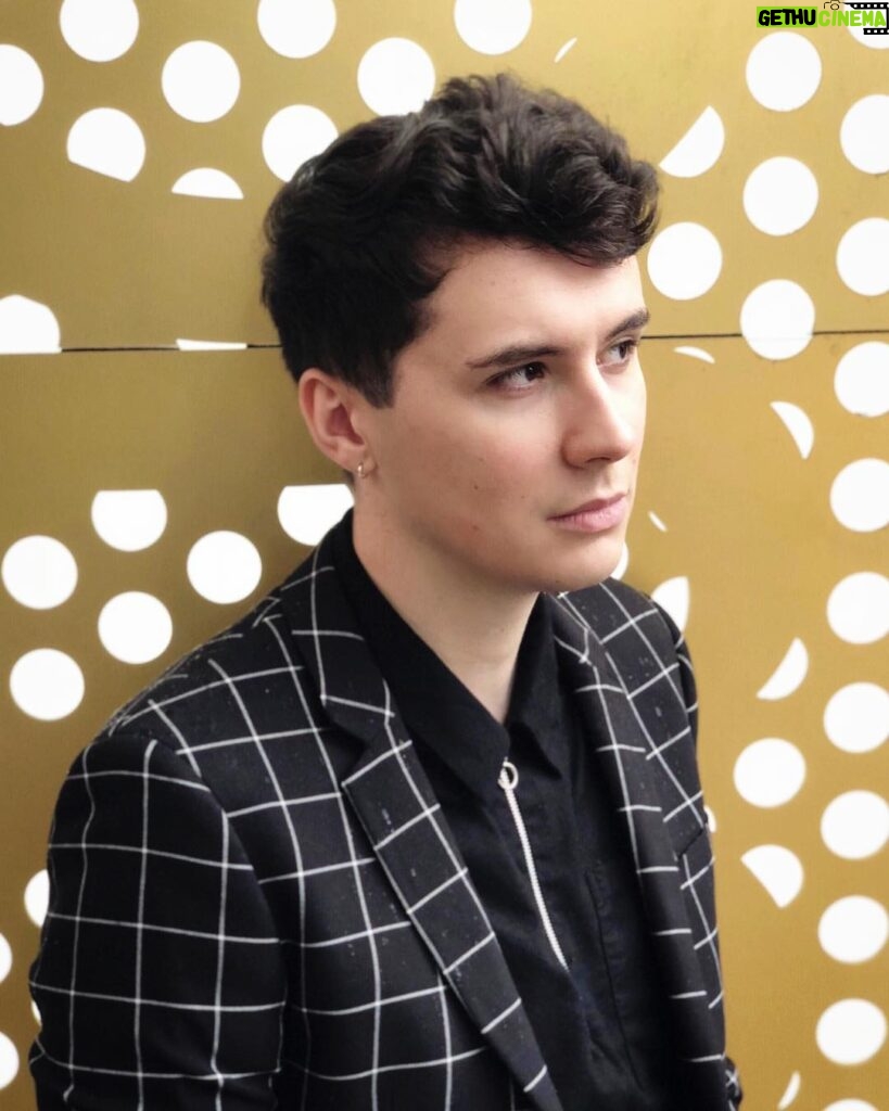Daniel Howell Instagram - smart casual but try to make it edgy and stand in the rain in front of an office full of people watching you do a photo shoot