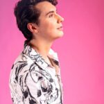 Daniel Howell Instagram - appreciate this image as you will never see something this colourful on my grid again i was only brave enough because i was completely covered in skulls thank you @attitudemag 💀 @alexandermcqueen 📷 @markus_bidaux 👕 @sachadance_ ✂️ @svenbayerbach