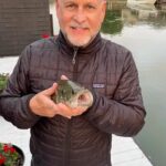 Dave Coulier Instagram - I didn’t catch one fish on our entire boat trip. Got home, threw a line in…and BAM! And the rest is fishtory. #captaincooler #thegreatoutdoors #boatlife Lake St. Clair