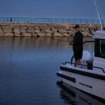 Dave Coulier Instagram - I’ve always heard that the fish really bite at sunset. Unfortunately, so do the mosquitoes. #captaincooler #boatlife #greatoutdoors #fishinginthedark Alpena, Michigan