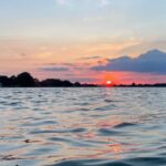 Dave Coulier Instagram - The simplest things in life bring the most joy. Exploring with our dogs, a bike ride, a swim, and a sunset. #captaincooler #greatoutdoors #boatlife #dogsofinstagram Lake Huron, Mi