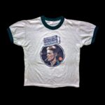 David Bowie Instagram – GOT THE RECORD AND THE T-SHIRTS?

“I like the tee shirts…” 

Never need an excuse to post a Steve Schapiro shot of David Bowie. 

As you no doubt know, this particular one was taken when Bowie appeared with Cher on her CBS TV show in September 1975, the show aired in November 1975.

The same image was used for the 40th anniversary Golden Years picture disc and an official 45th anniversary Young Americans T-shirt. 

However, a T-shirt utilising another picture of Steve‘s from the show was made available as the ON STAGE T-shirt in various colours in 1976 (see third image) and is now quite the collectors’ item. 

Do you still have yours?

#BowieSchapiro #BowieCher #DBTshirt