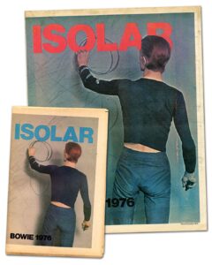 David Bowie Instagram - Please forgive the graininess of our latest Bowie Reflection. It’s an enlargement of TJ Newton (Bowie) on the set of The Man Who Fell To Earth, taken by David James. Here’s the caption from the reverse of the uncropped photo: “Mary-Lou (CANDY CLARK) tries to break down formal barriers between herself and Thomas Jerome Newton (DAVID BOWIE) when she invites him into her bathroom.” The second image is of Bowie’s original artwork (see signature bottom right), a collage he created utilising two other stills from the same scene. If you’re unfamiliar with this piece, it first appeared as a full-page in the 1976 ISOLAR tour programme and it was also an exhibit at the David Bowie Is V&A exhibition. (See last image) Look closely at Bowie’s reflection and the bubbles in the bath. A bit of pre-Photoshop scalpel work by Bowie. Thankfully, his replacement of the bubbles with Linoleum keeps us on the right side of social platform censors. The original image of Mary Lou was a little more revealing. #BowieReflections
