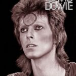 David Bowie Instagram – SORROW SINGLE IS FIFTY TODAY

“You’re out there playing your high class games of sorrow…”

As you know, next week marks the 50th anniversary of Bowie’s #1 album Pin Ups, originally released 19th October 1973.

Just one single was issued from the album in the UK, a version of The McCoys’ Sorrow, which later enjoyed wider recognition via The Mersey’s rendition. 

Bowie’s superb stab at the song reached #3 in the UK and it also gave him his first #1 anywhere in the world when it hit the top spot in Australia, New Zealand, and South Africa.

Following mono adverts of the Pin Ups sleeve advertising Sorrow in this week’s music press fifty years ago, variations of our main image (taken by @therealmickrock) were used in the promotion of Sorrow, as you can see from the second slide, including three UK versions of the sheet music. 

The sweet surprise all those years ago was another cover, Bowie’s sublime version of Amsterdam on the B side of Sorrow…more of which soon. 

#BowiePinUps50 #BowieSorrow50