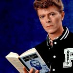 David Bowie Instagram – BOWIE’S AMERICAN LIBRARIES READ CAMPAIGN AND THE IDIOT

“Calling Sister Midnight, Well, I’m an idiot for you…” 

Back in 2013 we posted BOWIE’S TOP 100 BOOKS – THE COMPLETE LIST: https://www.davidbowie.com/blog/2013/10/1/bowies-top-100-books-the-complete-list (Linktree in bio)

In 1986 photographer Chalkie Davies produced the portraits here of Bowie with Fyodor Dostoevsky’s The Idiot*, a book not on the list, but that’s no reason not to view these images again.

They were made for the American Library Association‘s READ campaign, and specifically for the 1987 David Bowie for America’s Libraries READ poster, and associated items such as bookmarks. 

* David suggested the title for the Iggy Pop album of the same name. He also took the cover shot of Iggy based on Erich Heckel’s painting Roquairol. The photograph is often miscredited to Andrew Kent. Perhaps Iggy can remember the moment?

@iggypopofficial 
@chalkiedavies 

#BowieBookClub #BowieBookLover #FyodorDostoevskyTheIdiot #IggyPopTheIdiot