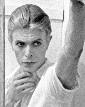David Bowie Instagram - Please forgive the graininess of our latest Bowie Reflection. It’s an enlargement of TJ Newton (Bowie) on the set of The Man Who Fell To Earth, taken by David James. 

Here’s the caption from the reverse of the uncropped photo: “Mary-Lou (CANDY CLARK) tries to break down formal barriers between herself and Thomas Jerome Newton (DAVID BOWIE) when she invites him into her bathroom.”

The second image is of Bowie’s original artwork (see signature bottom right), a collage he created utilising two other stills from the same scene.

If you’re unfamiliar with this piece, it first appeared as a full-page in the 1976 ISOLAR tour programme and it was also an exhibit at the David Bowie Is V&A exhibition. (See last image)

Look closely at Bowie’s reflection and the bubbles in the bath. A bit of pre-Photoshop scalpel work by Bowie.

Thankfully, his replacement of the bubbles with Linoleum keeps us on the right side of social platform censors. The original image of Mary Lou was a little more revealing. 

#BowieReflections