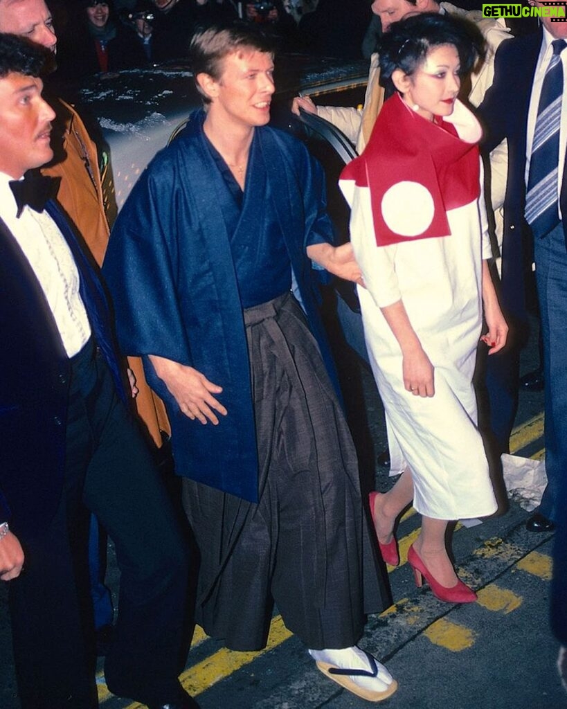 David Bowie Instagram - JUST A GIGOLO LONDON PREMIERE 45 YEARS AGO TODAY “Came to London town...” The London premiere of Just a Gigolo took place on Valentine’s Day 1979. The first image here is of Bowie with Just A Gigolo co-star Sydne Rome at a photo call at Café Royal in Regent Street. The film’s premiere took place at the Prince Charles Cinema in Leicester Square where David is pictured with Viv Lynn. The premiere invitation stated that twenties-style dress or black tie was compulsory. Bowie wore a dark blue kimono with baggy grey trousers and Japanese style footwear, while his date wore Willie Brown. #BowieJustAGigolo #JustAGigolo #Bowie1979