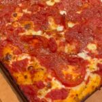 David Chang Instagram - Made a square pie while it rained all day in la. Came our pretty great. That @biancodinapolitomatoes pizza sauce is 🤌🏼…served with @momofukugoods black truffle chili crunch!