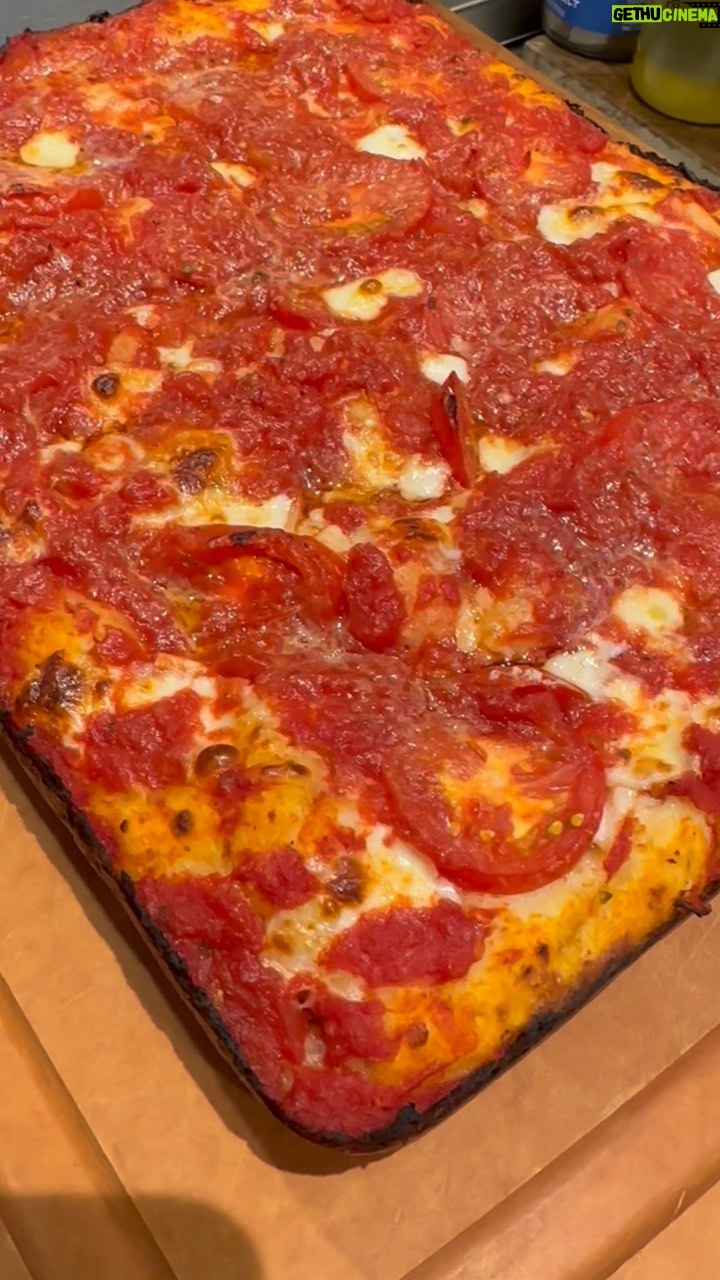 David Chang Instagram - Made a square pie while it rained all day in la. Came our pretty great. That @biancodinapolitomatoes pizza sauce is 🤌🏼…served with @momofukugoods black truffle chili crunch!