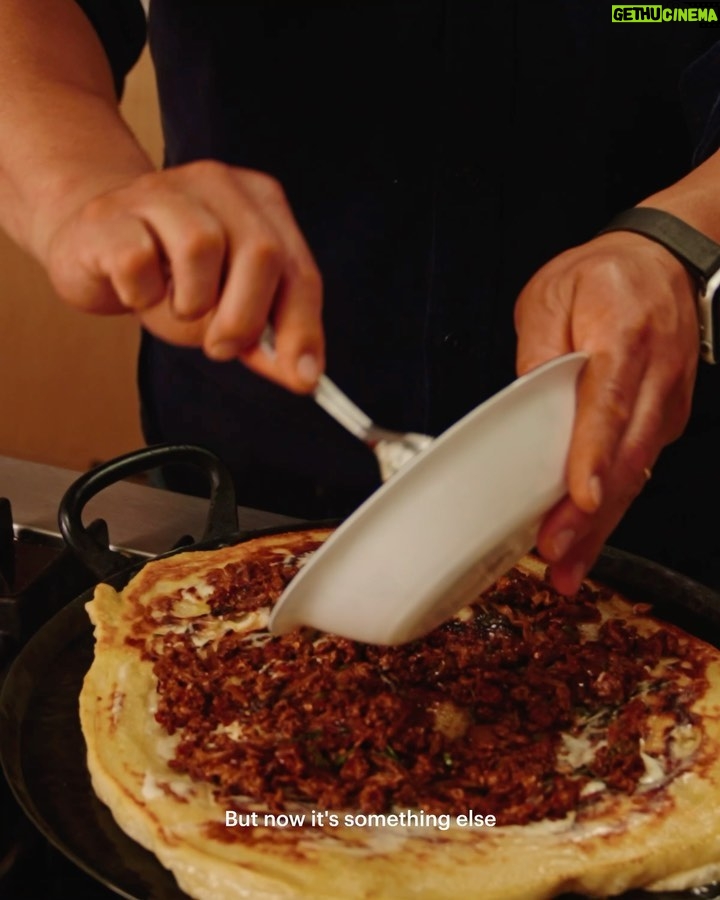 David Chang Instagram - Still not pro homemade pizza …but I made this thing with leftover @momofukugoods chili crunch pork ragu and pizza dough I found in the fridge. Good things happen when you cook without a safety net. Watch the full video at the link in my bio.