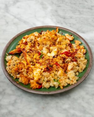 David Chang Instagram - Fried rice is the best breakfast…probably make this for breakfast more than anything else. Whatever is leftover in the fridge goes in - also used @momofukugoods soy, savory, and chili crunch. Watch the full video at the link in my bio.