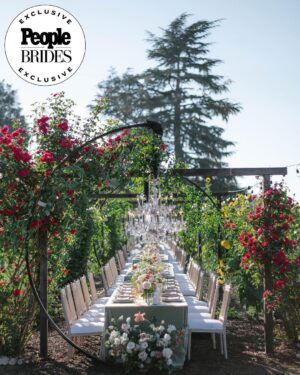 Derek Hough Instagram - "Regal redwoods" was the theme of @derekhough and @hayley.erbert's wedding in Carmel, California. From Hayley's custom Marchesa wedding gown and @inesdisanto reception dress to the opulent chandeliers and florals, see all the photos from their star-studded celebration at the link in bio. 
📷: @amyandstuart
📋: @simplytroy
💐: Jimmy Hartman of @inblumela
👗: @marchesafashion and @inesdisanto
💇‍♀️: @jill901
💄: @emmawillishmu
🪧: @katecozziegraphicarts
🎥: @whiteinrevery
📍: @santaluciapreserve
🍰: @kellygraycakes
💡: @signaturechandeliers
🍽️: @theonicollection