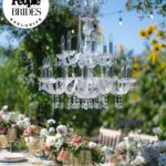 Derek Hough Instagram - "Regal redwoods" was the theme of @derekhough and @hayley.erbert's wedding in Carmel, California. From Hayley's custom Marchesa wedding gown and @inesdisanto reception dress to the opulent chandeliers and florals, see all the photos from their star-studded celebration at the link in bio. 📷: @amyandstuart 📋: @simplytroy 💐: Jimmy Hartman of @inblumela 👗: @marchesafashion and @inesdisanto 💇‍♀️: @jill901 💄: @emmawillishmu 🪧: @katecozziegraphicarts 🎥: @whiteinrevery 📍: @santaluciapreserve 🍰: @kellygraycakes 💡: @signaturechandeliers 🍽️: @theonicollection