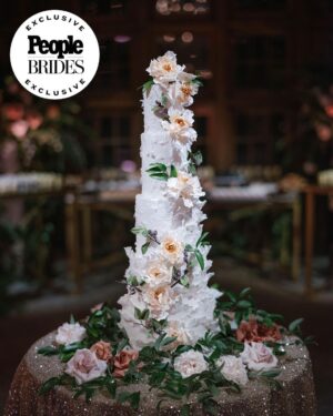 Derek Hough Instagram - "Regal redwoods" was the theme of @derekhough and @hayley.erbert's wedding in Carmel, California. From Hayley's custom Marchesa wedding gown and @inesdisanto reception dress to the opulent chandeliers and florals, see all the photos from their star-studded celebration at the link in bio. 
📷: @amyandstuart
📋: @simplytroy
💐: Jimmy Hartman of @inblumela
👗: @marchesafashion and @inesdisanto
💇‍♀️: @jill901
💄: @emmawillishmu
🪧: @katecozziegraphicarts
🎥: @whiteinrevery
📍: @santaluciapreserve
🍰: @kellygraycakes
💡: @signaturechandeliers
🍽️: @theonicollection