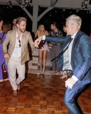 Derek Hough Instagram - Love ❤️ these two humans and so happy to celebrate with them on their big day! What makes these photos even better is looking at the reactions of people in the background 😂… ooo a flower 🌸 
📷: @christinamcneill