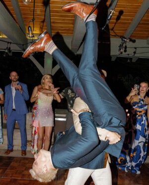 Derek Hough Instagram - Love ❤️ these two humans and so happy to celebrate with them on their big day! What makes these photos even better is looking at the reactions of people in the background 😂… ooo a flower 🌸 
📷: @christinamcneill