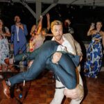 Derek Hough Instagram - Love ❤️ these two humans and so happy to celebrate with them on their big day! What makes these photos even better is looking at the reactions of people in the background 😂… ooo a flower 🌸 📷: @christinamcneill