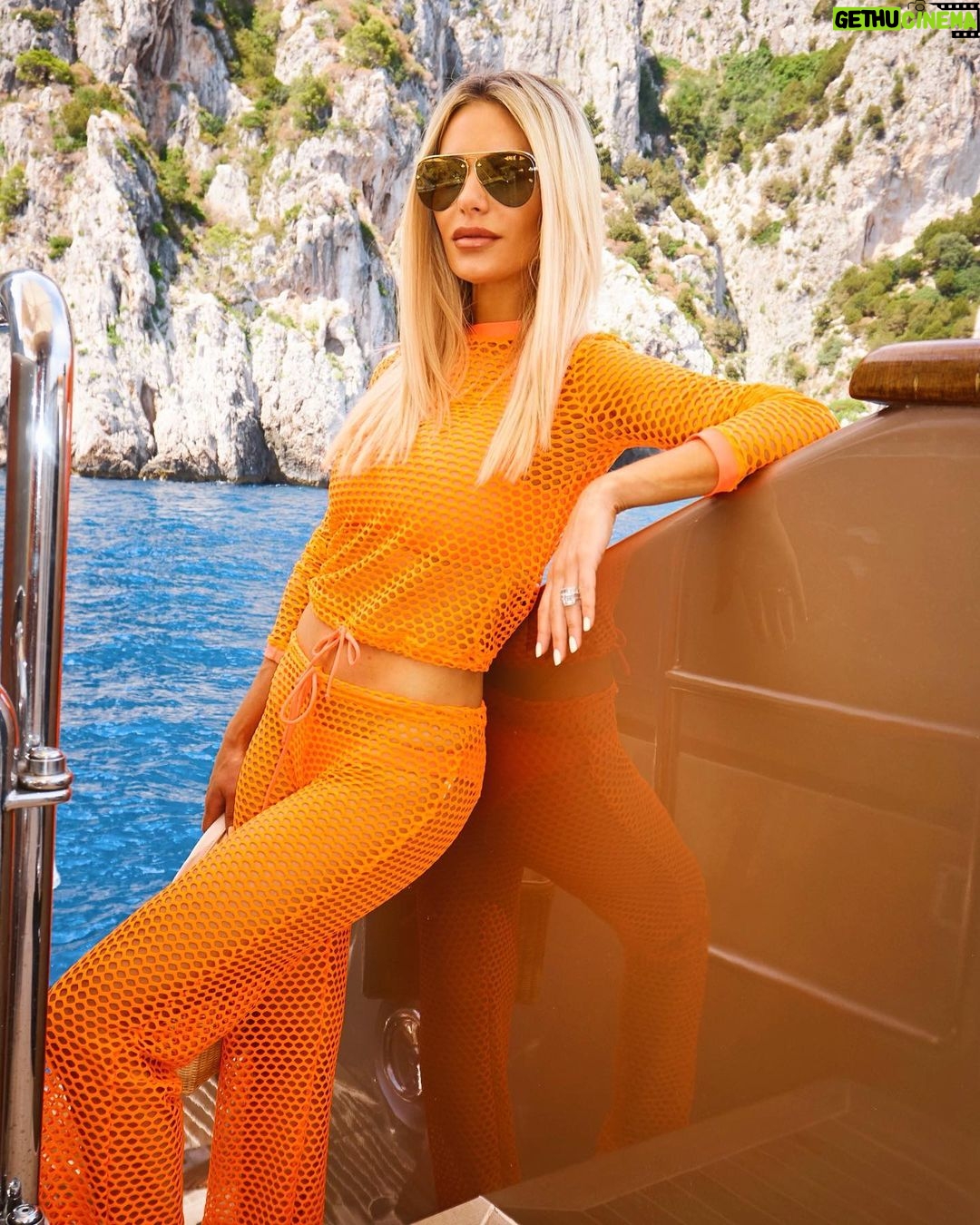 Dorit Kemsley Instagram - Our neon mesh top is great for day to night 🧡 Pair with your favorite bikini, boyfriend jeans, or over a tank for a chic look. Only a few sizes left and 75% off @beverlybeach ..