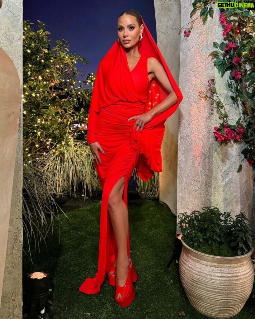 Dorit Kemsley Instagram - season 13 reunion look ❤️‍🔥 #rhobh @schiaparelli dress and @balmain shoes for a monochromatic, surrealist inspired ruby red look 👠📌❤️