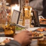Draymond Green Instagram - It’s my favorite time of the year…celebrating life with Family and Friends. Hazel and I hosted a Friendsgiving dinner complimented with the best tequila in the world @lobos1707 at @internationalsmoke. In the spirit of giving for every bottle of Lobos 1707 Tequila & Mezcal purchased in November, a meal will be donated through World Central Kitchen. Thousands of meals donated thus far!! P.S we are pretty wrinkled after a great night of Lobos lol #AllForThePack #BuildingABiggerTable International Smoke