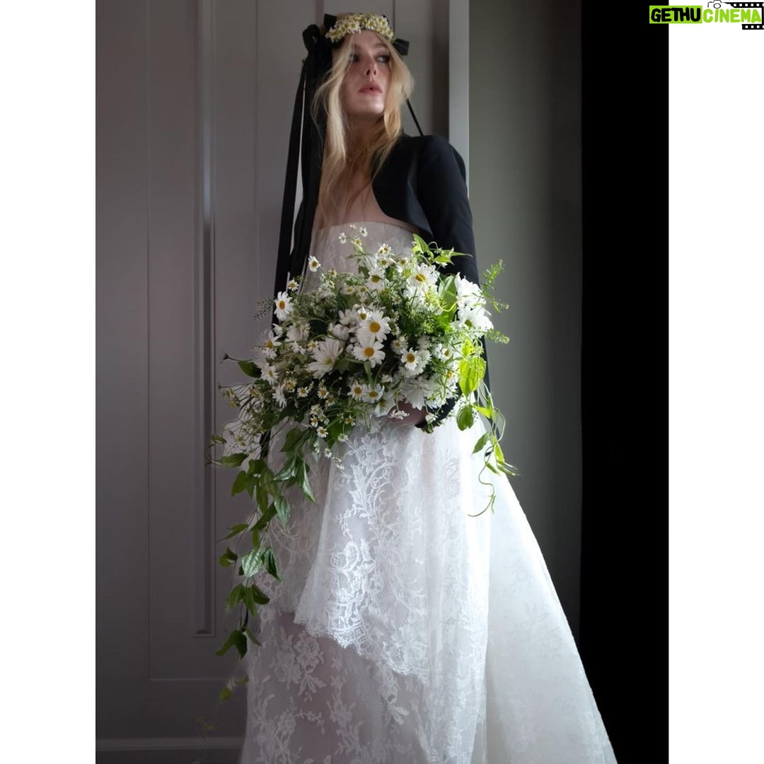 Elle Fanning Instagram - The first fashion show I ever attended was fall 2011 Chanel haute couture and I remember my bubbling anticipation to see what the bride would look like! Karl’s finale bride is always the ultimate. I wanted to combine the innocence of the portrait he took of me with Karl's tradition of ending each show with his vision of the Chanel bride. I have always felt safe going to Vivienne Westwood with my ideas. My original idea didn't have lace, but when I started researching Andreas's recent bridal collections, I saw this lace and it took my breath away. I wanted to include a little black jacket in my look for obvious reasons and I tucked my hair inside as a nod to the gesture of a groom throwing a jacket over his bride's shoulders at the end of the night. @viviennewestwood Karl liked that my jewelry was eclectic and put together the way only a 13 year old would do it. When I look at that portrait it's like a time capsule to that time of my life. Tonight I got to wear the iconic Grain de Cafe coffee bean necklace from 1955 curtesy of @cartier This vintage piece is not my own, but is “my something borrowed” for tonight. Stephen Jones worked alongside team Westwood to custom design the frame for my daisy crown. It was a honor having him in the room with us fitting the frame and ironing the ribbons himself. @stephenjonesmillinery The floral fairies from Belle Fleur turned my hotel room into a flower shop, creating my cascading daisy bouquet, which made my homage complete. @bellefleurny And of course lace nails to match by @nailsbymarysoul Dream girl makeup by @erinayanianmonroe Romantic hair by @justjenda and impeccable styling by @samanthamcmillen_stylist 📸 by @chloerosey